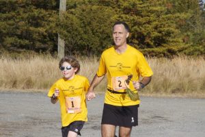 Nik enjoys running alongside his father, Dan, in races.